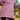 Person wearing a pink Longline Hoodie with floral sleeves in an outdoor setting