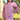 Woman wearing a pink Longline hoodie with floral sleeves standing outdoors near a fence.