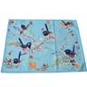 Decorative placemat with bird design on a blue background