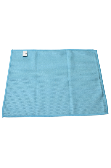 Blue textured towel with a brand tag on a white background