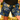 Person wearing blue floral shorts standing in a natural setting